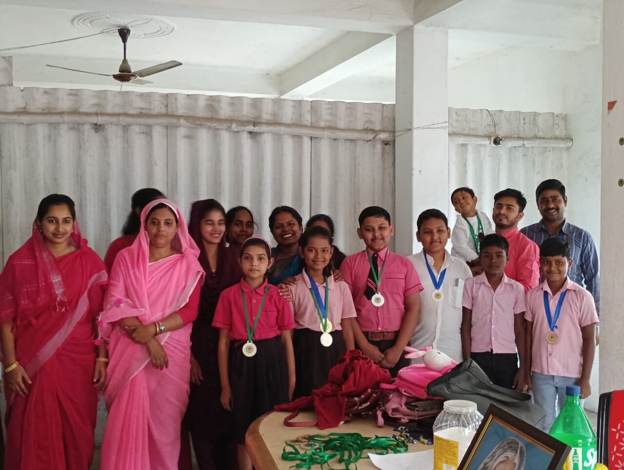 Students receiving medals at the annual prize distribution of Children Planet Public School